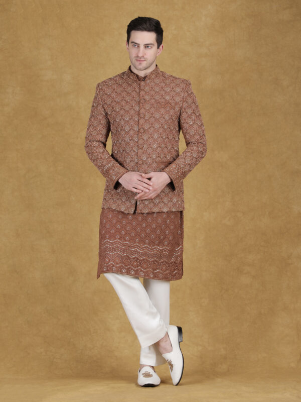 Rust reception bandhgala with zari and thread embroidery featuring dense floral jaal pattern
