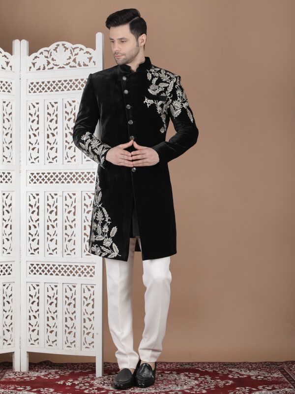 Black reception sherwani with silver embroidery on shoulder and chest with bold floral design