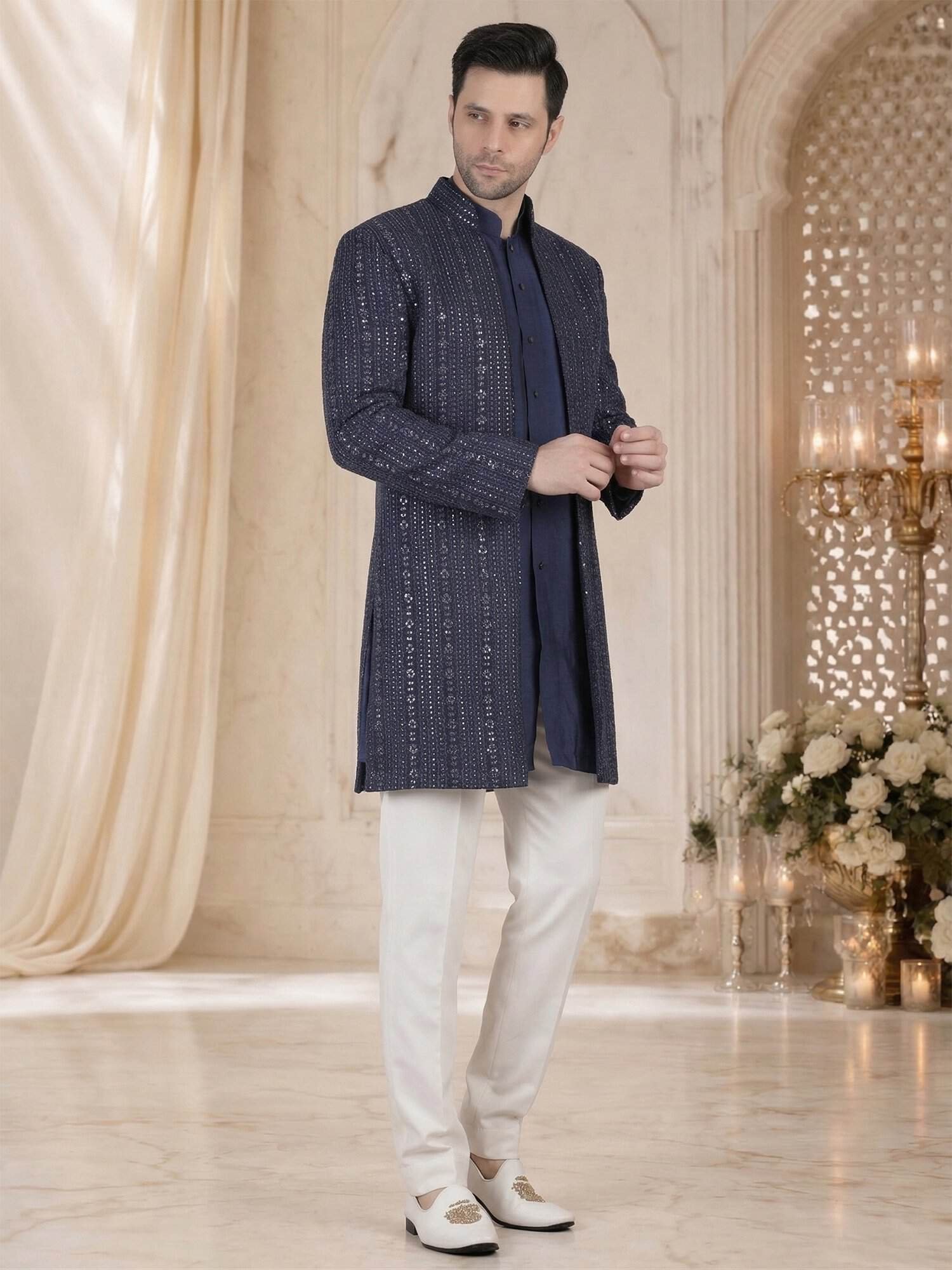 Navy blue indo western sherwani style jacket with white churidar for men wedding wear