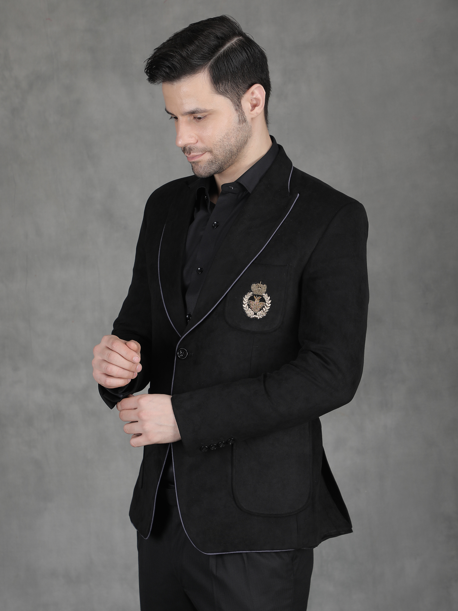 Black suede blazer with hand motif embroidery for reception wear