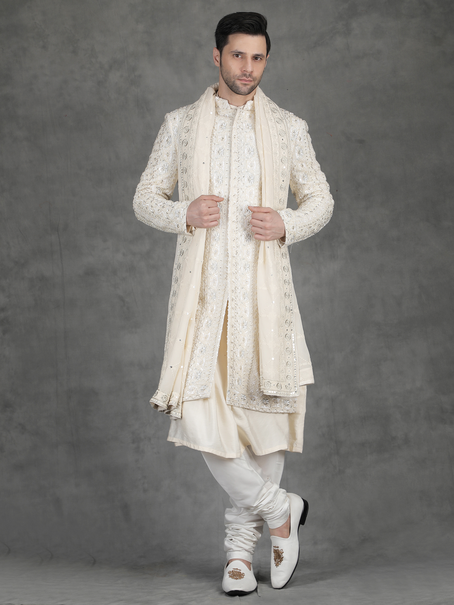 Ivory sequin embroidery sherwani for groom with detailed vertical pattern and premium handcrafted work