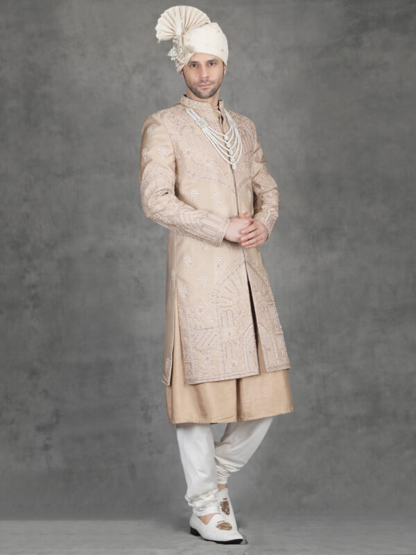 Peach embroidery sherwani for groom with detailed thread and zari work and royal wedding look