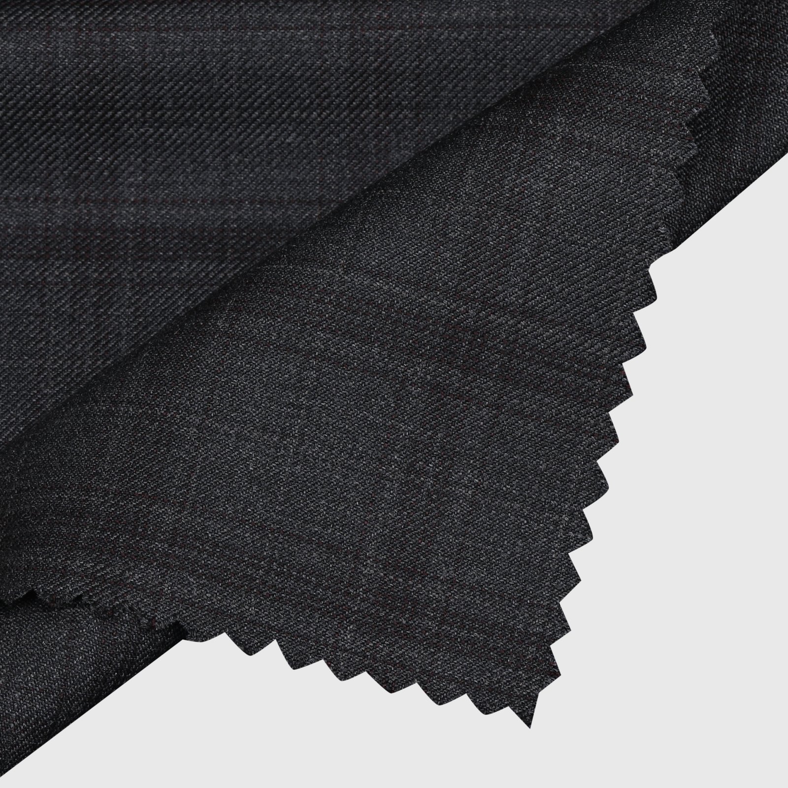 Shadow plaid suiting fabric featuring a subtle dark charcoal plaid pattern on a finely woven texture, premium formal wear material ideal for tailored suits, blazers, trousers, waistcoats, and sophisticated business attire.